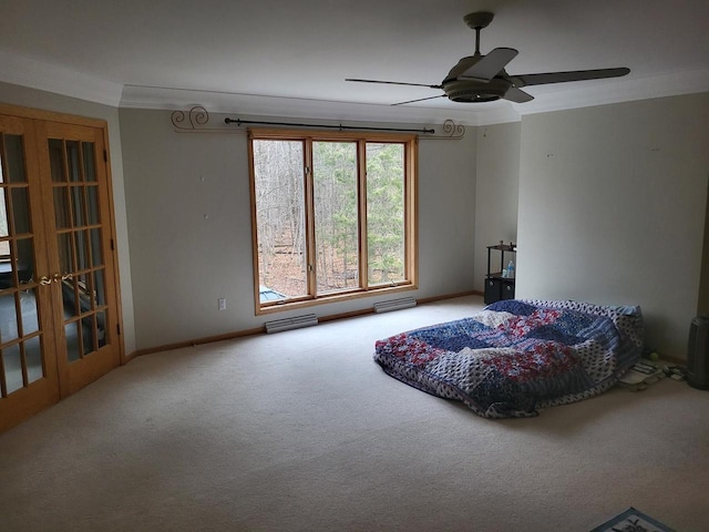 bedroom with carpet flooring, ceiling fan, crown molding, and french doors