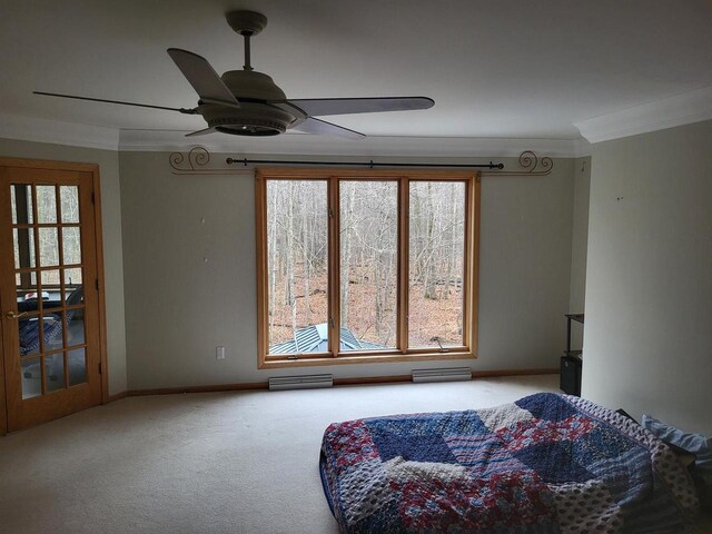 living area with carpet floors, ceiling fan, and ornamental molding