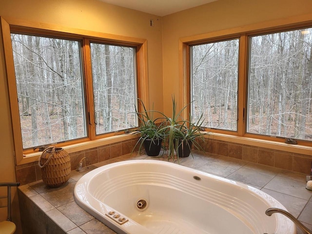 bathroom featuring a relaxing tiled tub