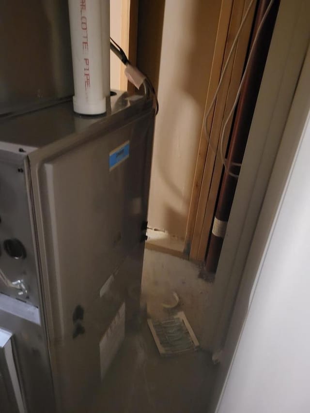 utility room with heating unit