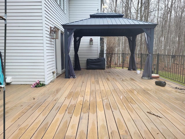 wooden deck featuring a gazebo