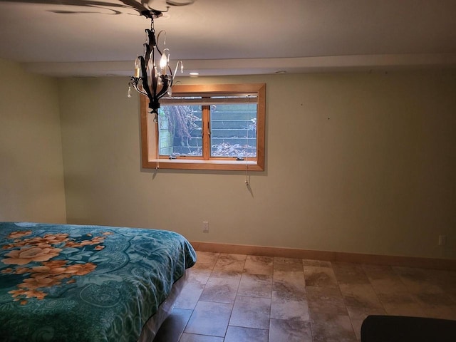 unfurnished bedroom featuring an inviting chandelier