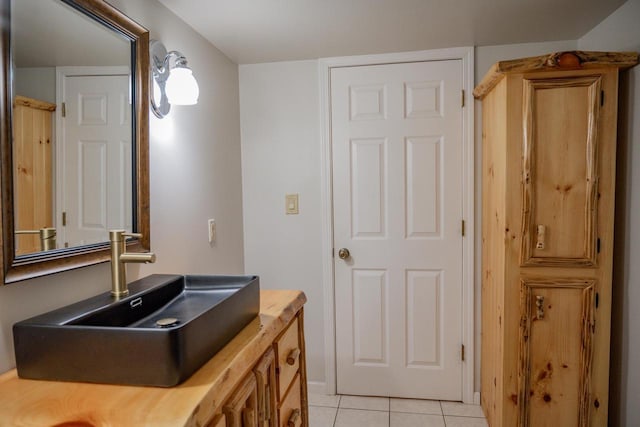 bathroom with tile patterned flooring and vanity