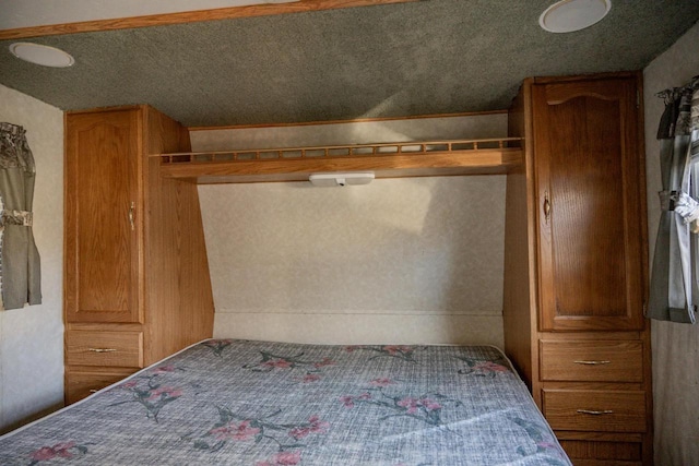 unfurnished bedroom featuring a textured ceiling