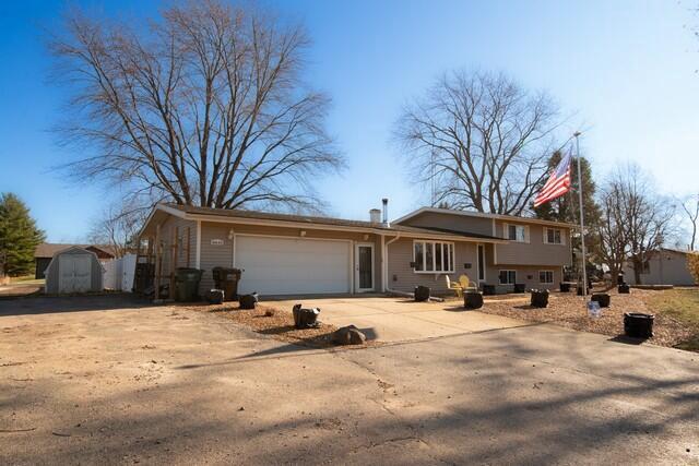 split level home featuring a garage