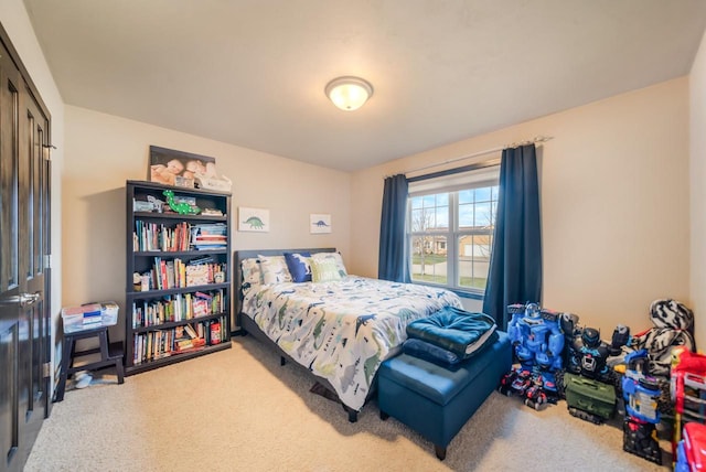 bedroom with a closet and carpet