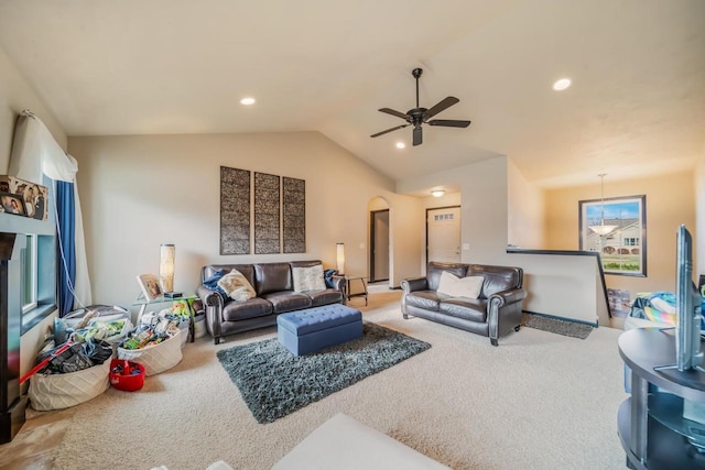 living room featuring ceiling fan, lofted ceiling, and carpet floors