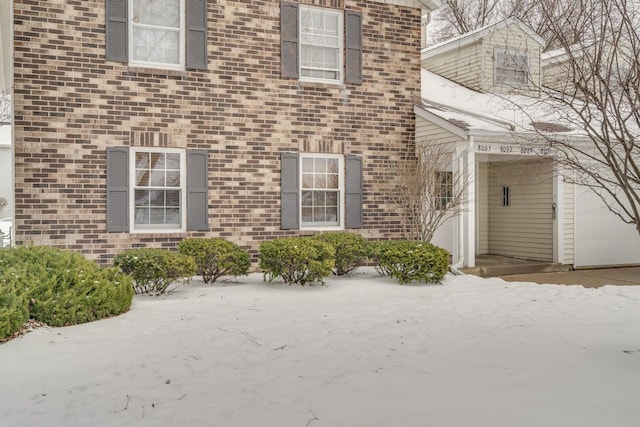 view of snow covered property entrance