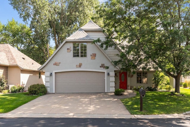 view of front facade featuring a front yard and a garage