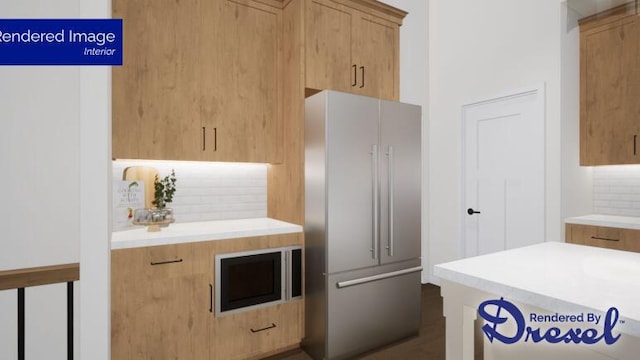 kitchen featuring high end refrigerator, backsplash, and light brown cabinetry