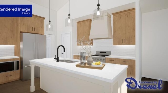 kitchen featuring pendant lighting, an island with sink, stainless steel appliances, and sink