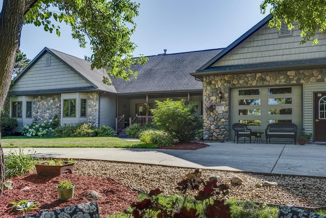 rear view of house with a garage