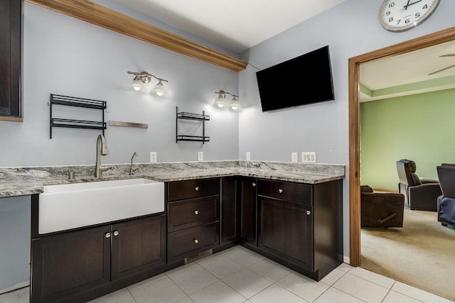 bathroom with tile patterned floors and vanity