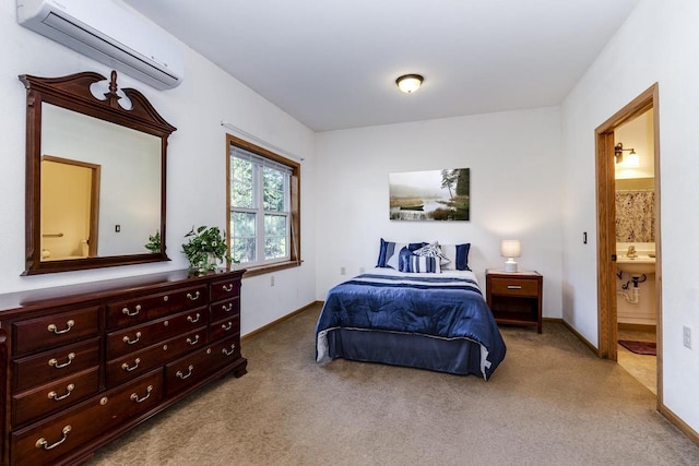 carpeted bedroom with connected bathroom and an AC wall unit