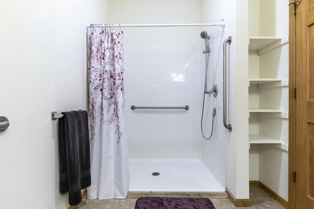 bathroom featuring tile patterned flooring and a shower with curtain