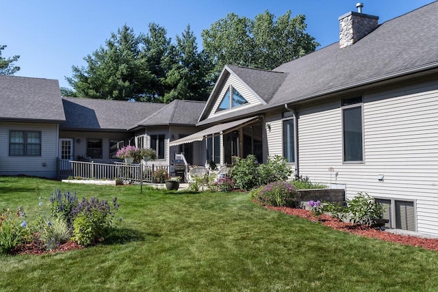 back of house featuring a yard