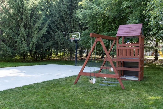 view of play area with basketball court and a yard