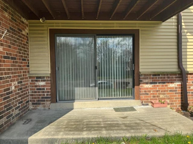 entrance to property with a patio