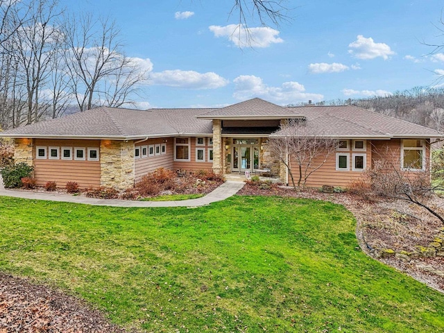 prairie-style home featuring a front yard