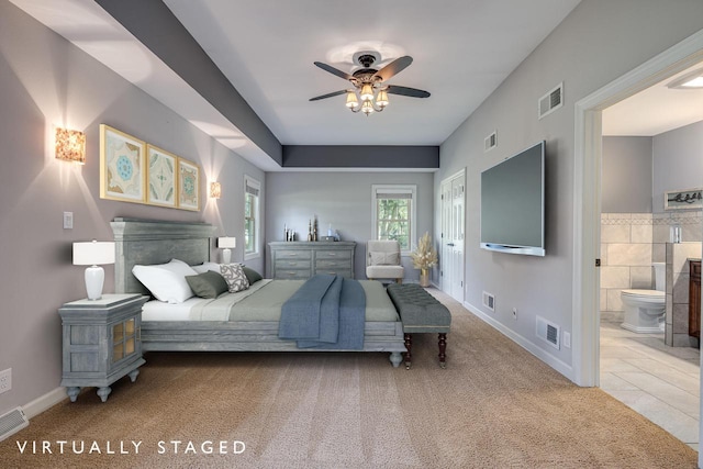 bedroom featuring ensuite bathroom, ceiling fan, and light tile patterned floors