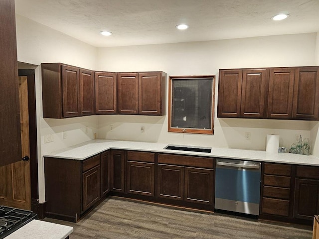 kitchen with dishwasher, wood-type flooring, and sink