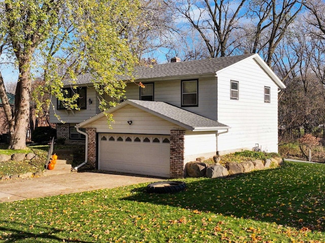 front of property with a garage and a front lawn