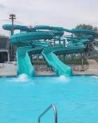 view of swimming pool with a water slide