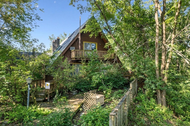 back of property with a balcony