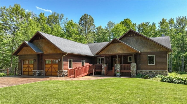 craftsman house featuring a front lawn and covered porch