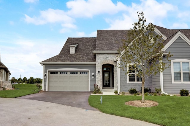 view of front facade featuring a front yard and a garage