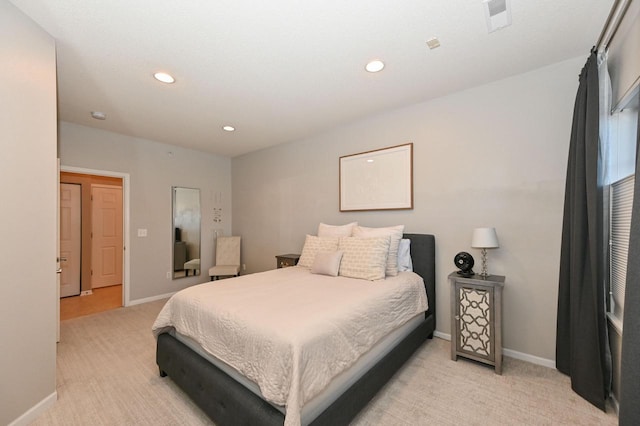 bedroom featuring light colored carpet