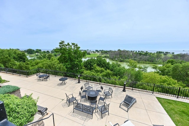 view of patio with a water view