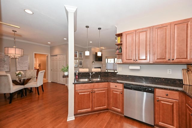 kitchen with pendant lighting, hardwood / wood-style flooring, stainless steel dishwasher, and ornamental molding