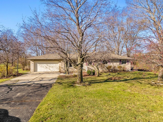 view of front facade with a front yard and a garage