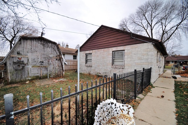 view of property exterior featuring an outbuilding