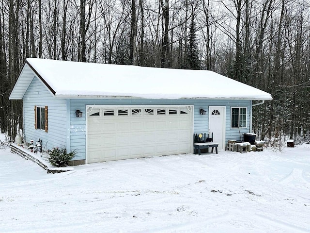 ranch-style house featuring a garage