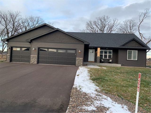 view of front of house with a garage and a front yard