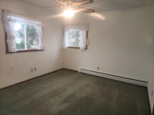 carpeted empty room with a baseboard radiator and ceiling fan