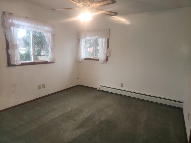 41 E Vista Blvd, Markesan, WI 53946 - unfurnished room with ceiling fan, baseboard heating, dark colored carpet, and baseboards