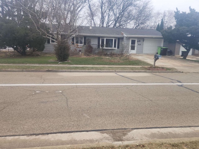 single story home featuring a garage