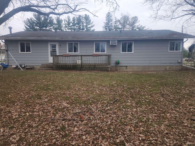 41 E Vista Blvd, Markesan, WI 53946 - rear view of property featuring a deck, roof with shingles, and a lawn