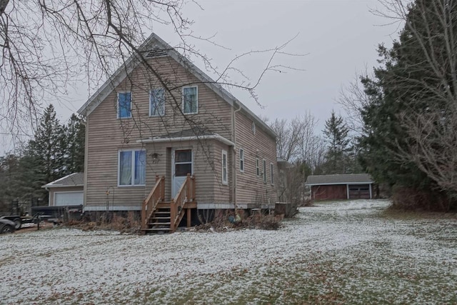 front of property with an outbuilding and a garage