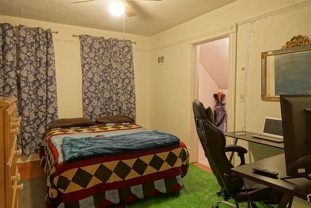 bedroom featuring wood-type flooring and ceiling fan