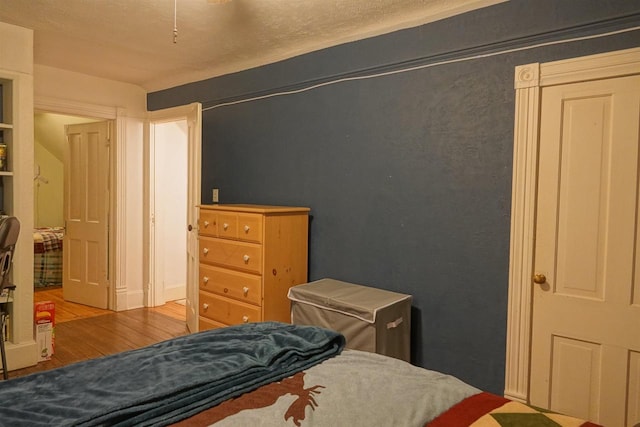 bedroom with wood-type flooring