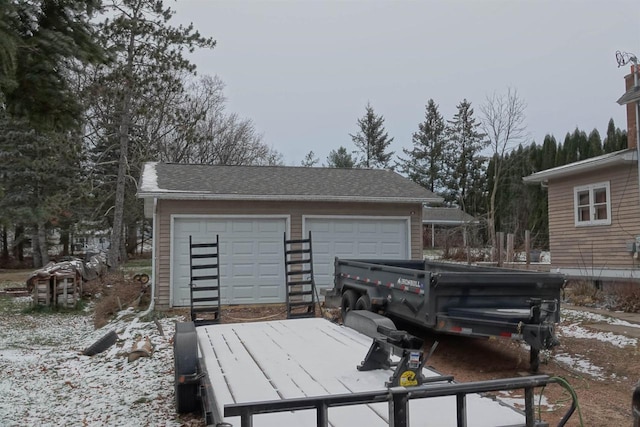 view of snow covered garage