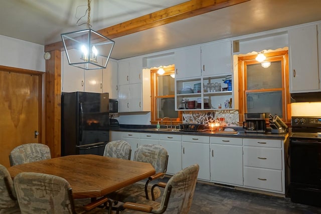 kitchen featuring beam ceiling, hanging light fixtures, white cabinets, and black appliances