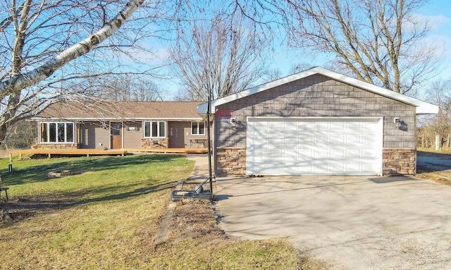 ranch-style house featuring a garage and a front yard