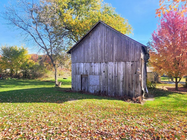 view of outdoor structure with a lawn