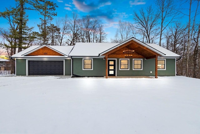 ranch-style house featuring a garage