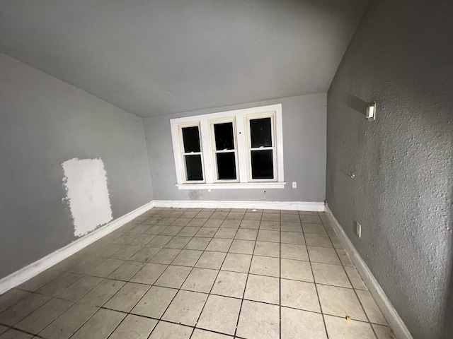 unfurnished room with light tile patterned floors